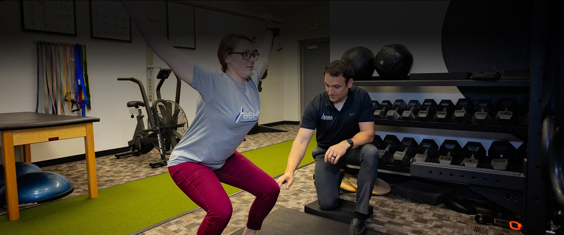 chiropractor performing functional movements screen with patient