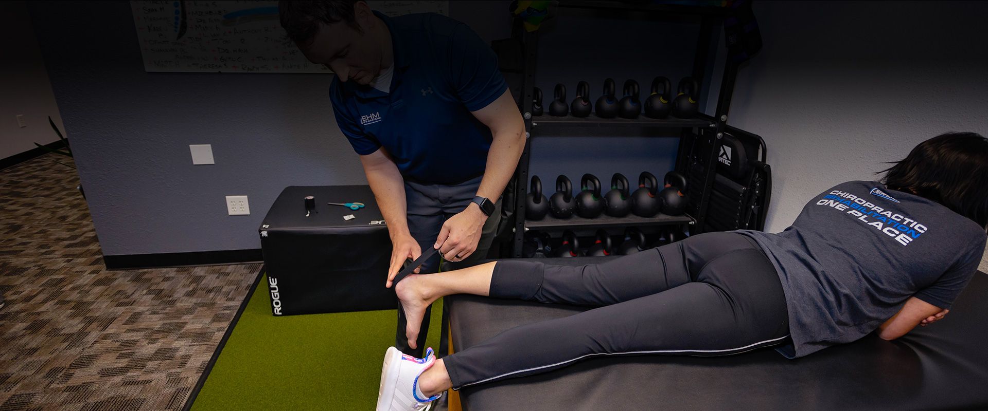 rock tape being applied to chiropractic patient