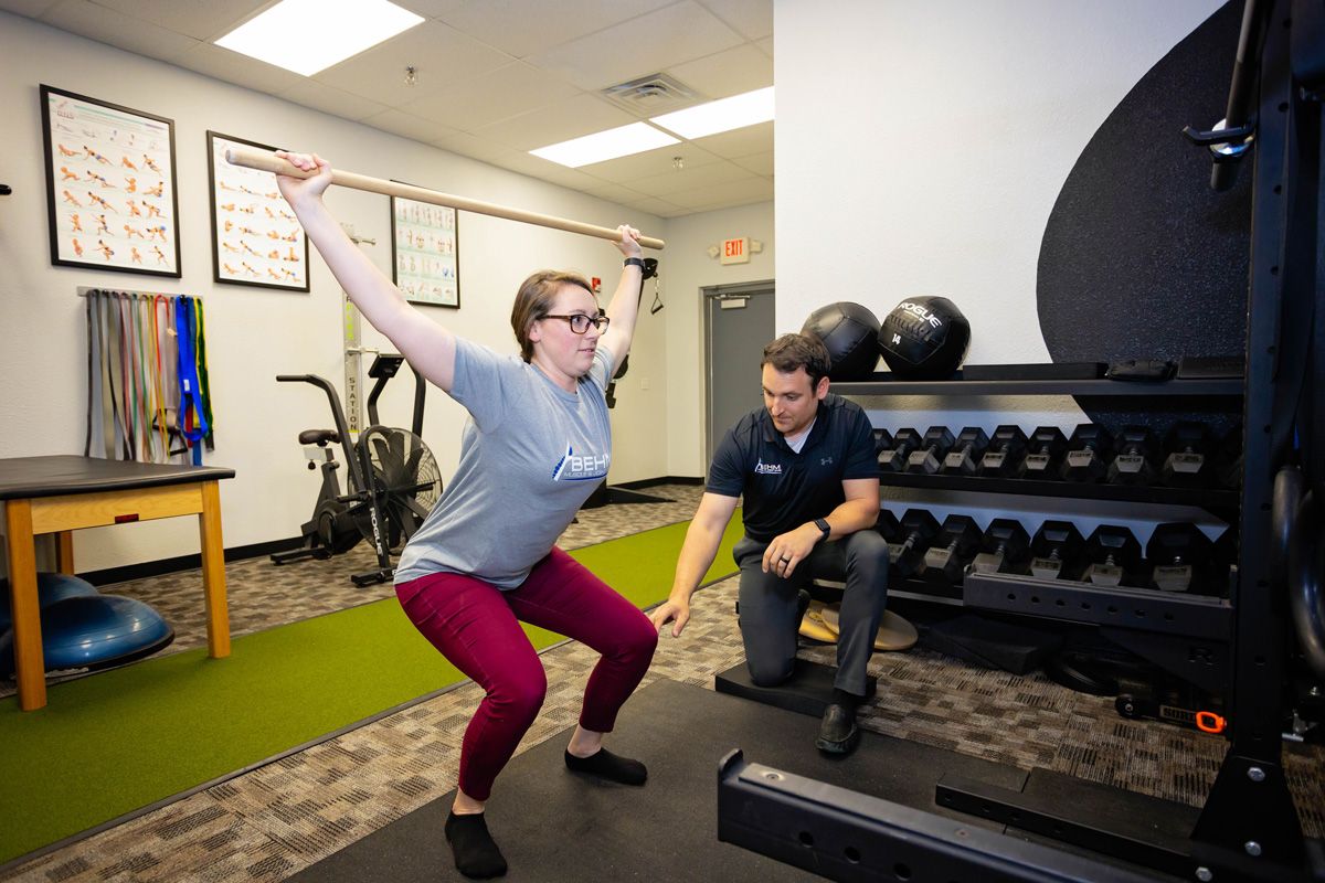 chiropractor performing movement screen