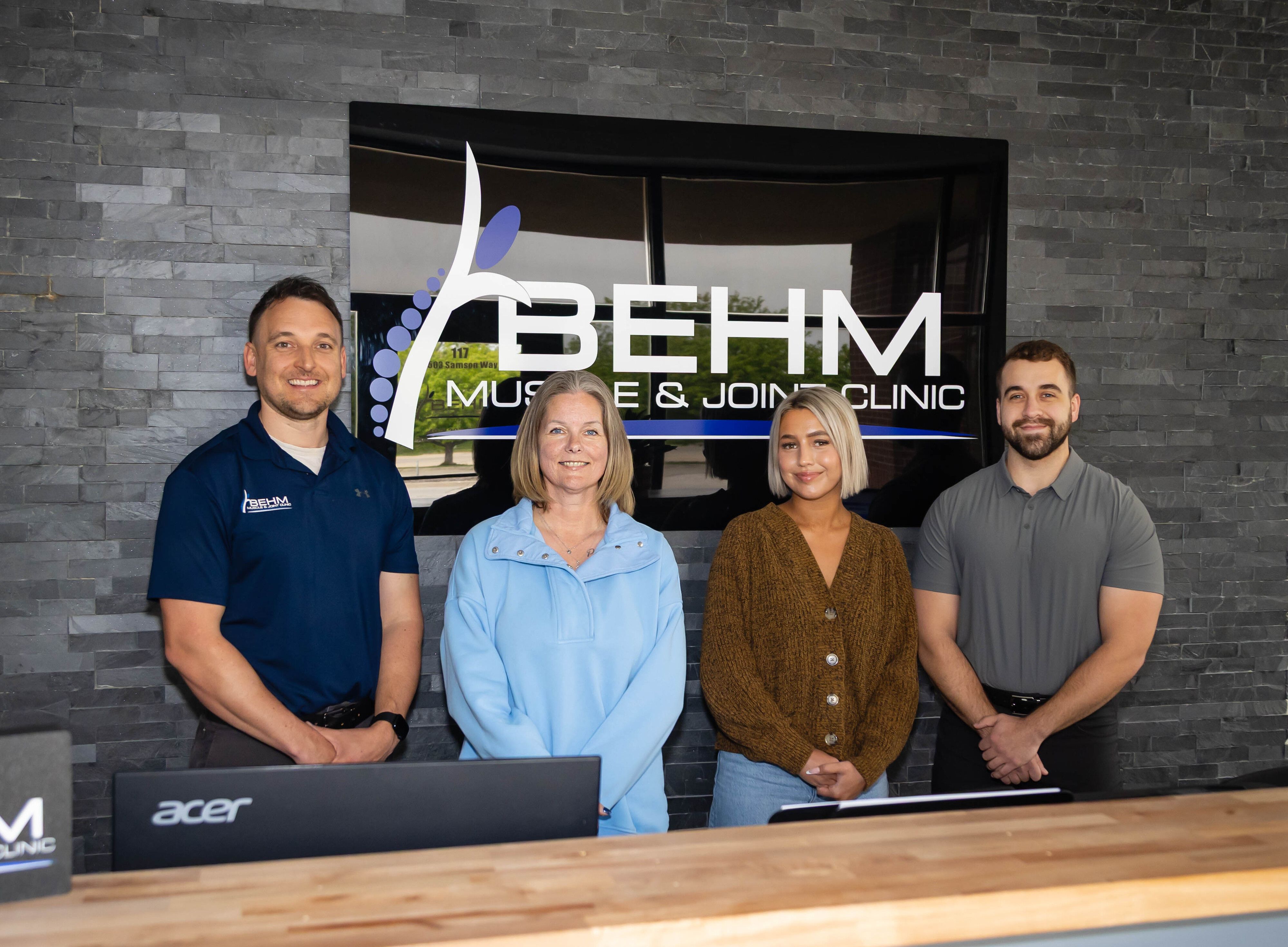 chiropractic team shown at our clinic in Bellevue, NE