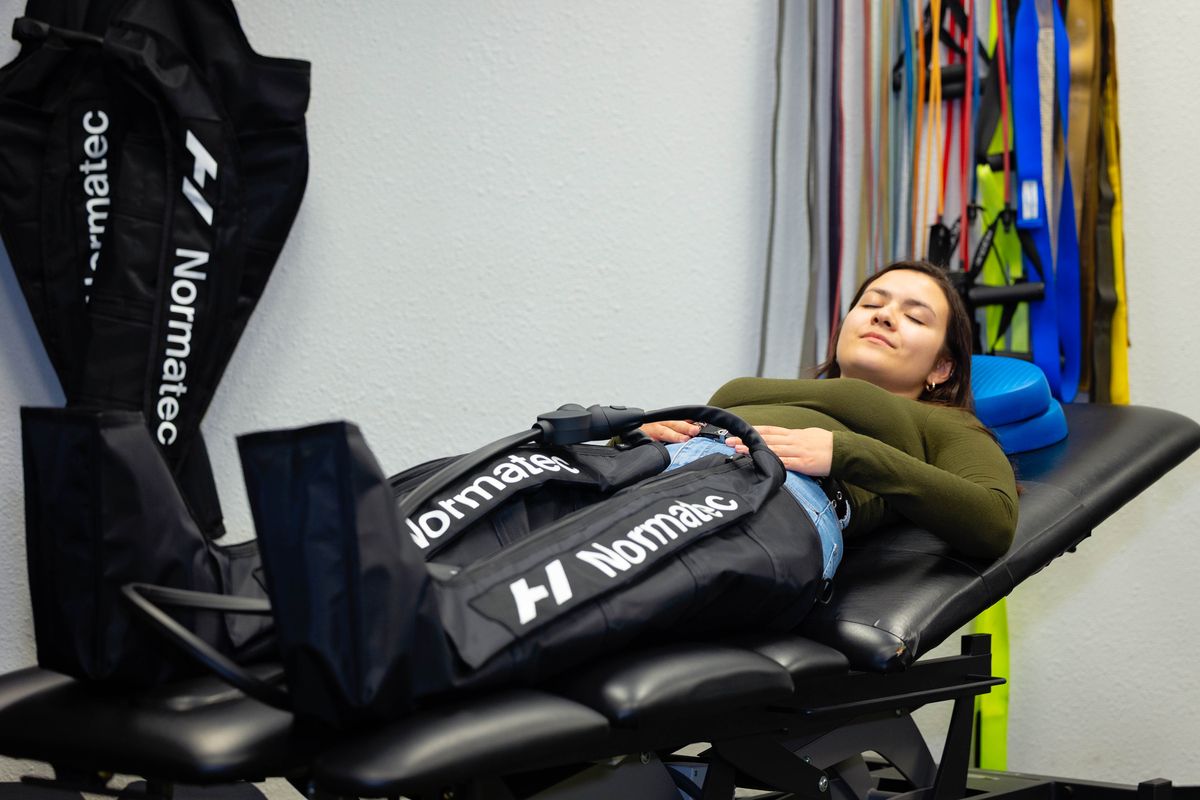 patient using normatec recovery boots on legs