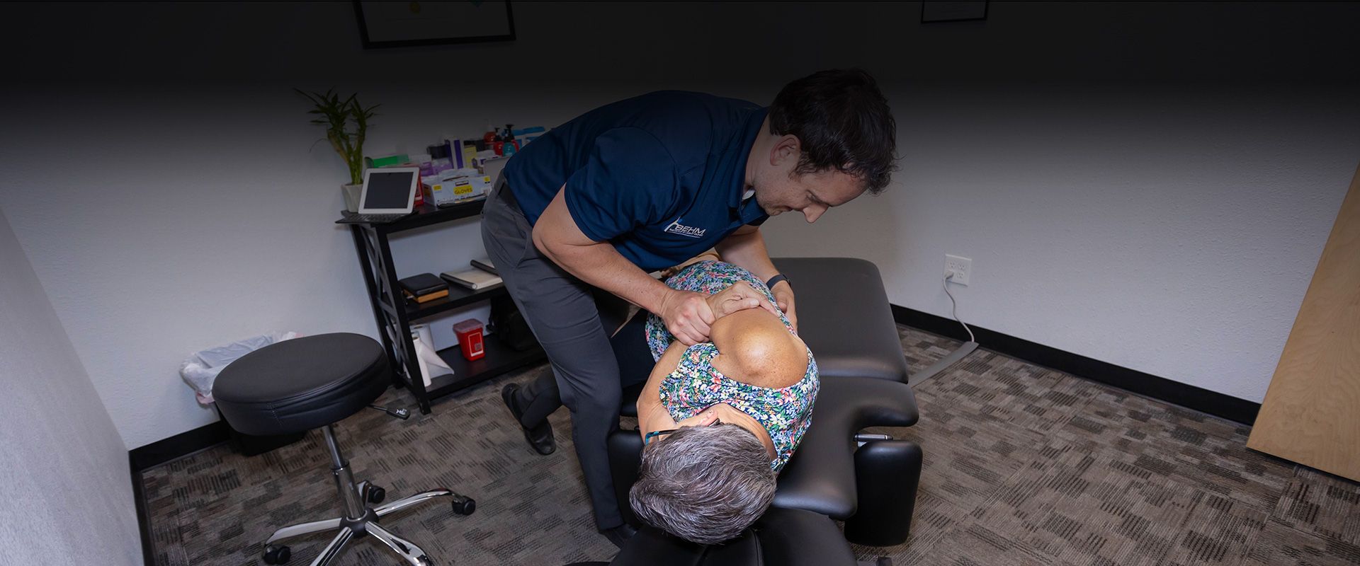 chiropractor adjusting patient