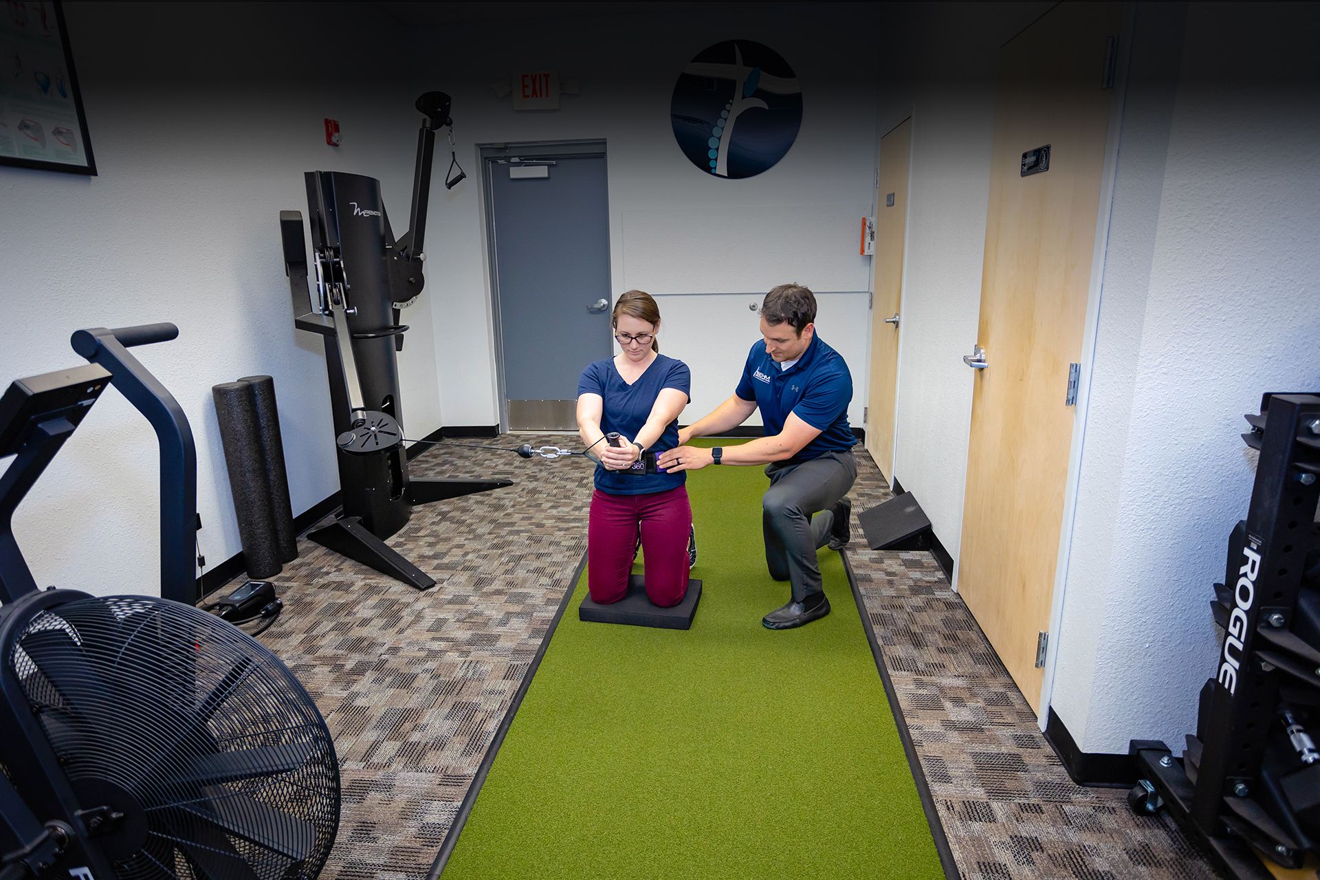 patient being treated by chiropractor in our physical therapy bay