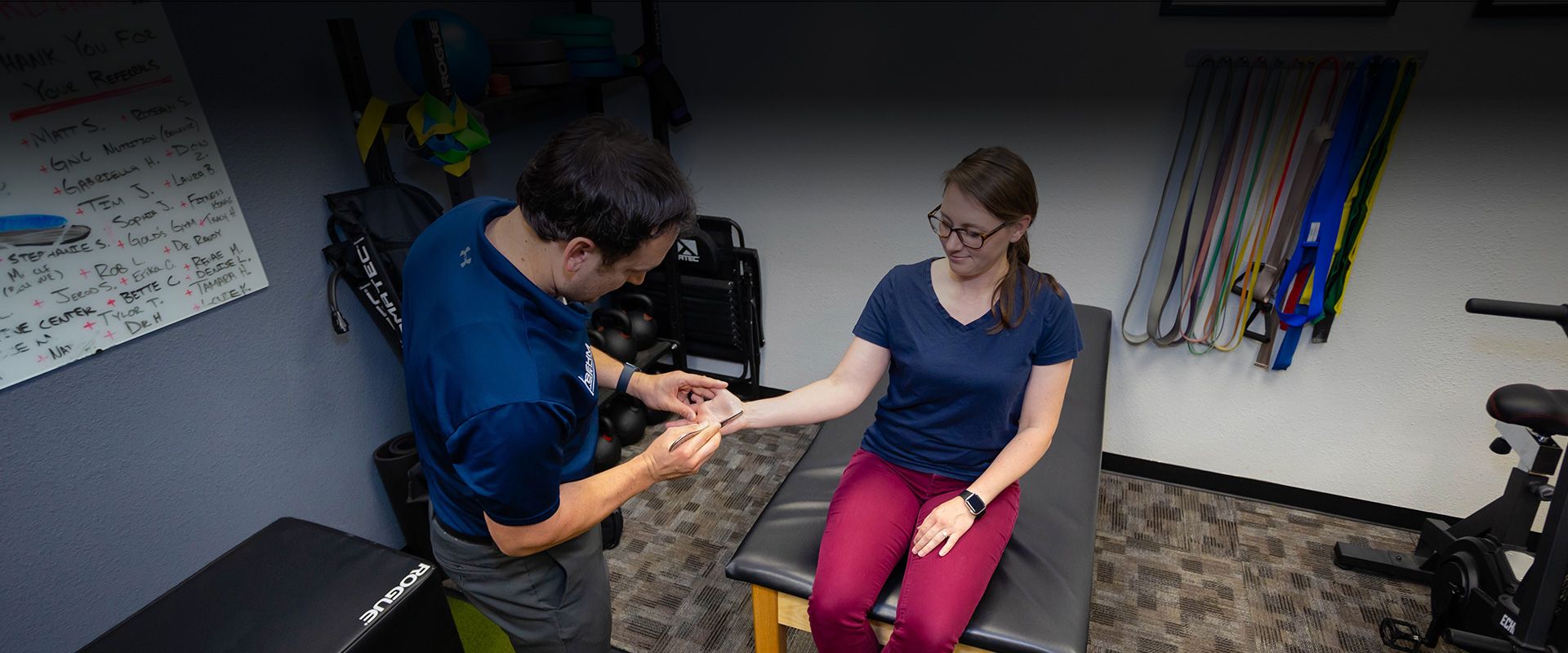 Instrument Assisted Soft Tissue Mobilization (IASTM) used on patient's hand