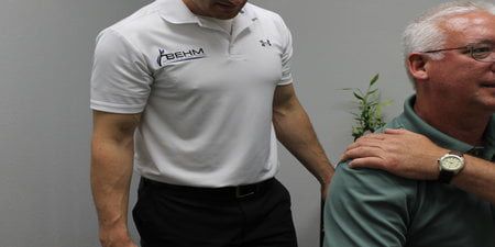 patient showing arm pain to chiroproctor