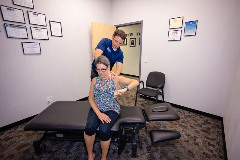chiropractor, Adam Behm, treating a patient