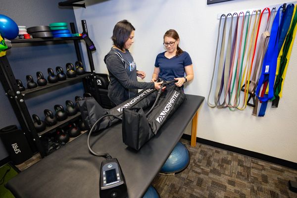 patient using normatec recovery boots on legs